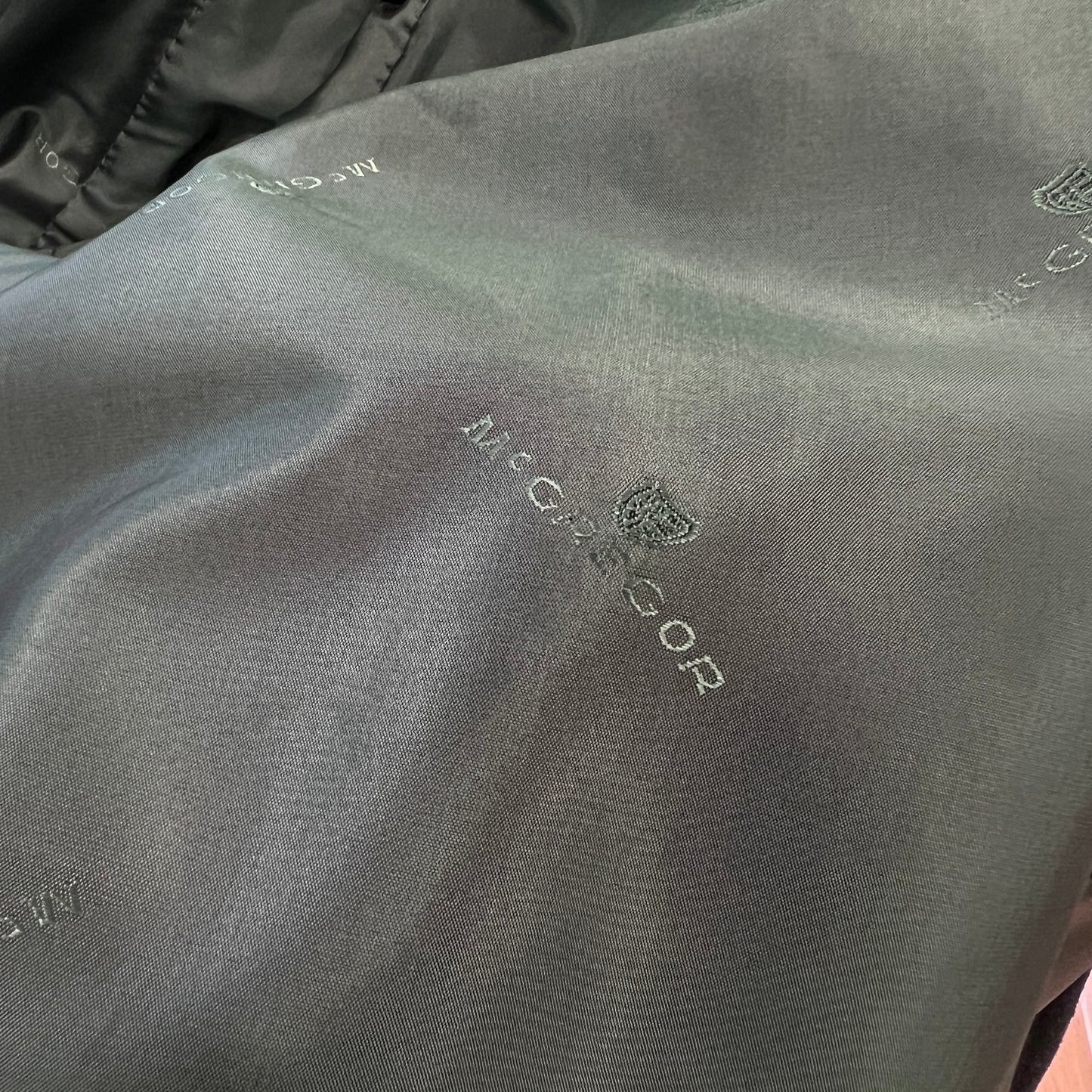 Close-up of a textured fabric surface with 'Nicce & Nyc' branding