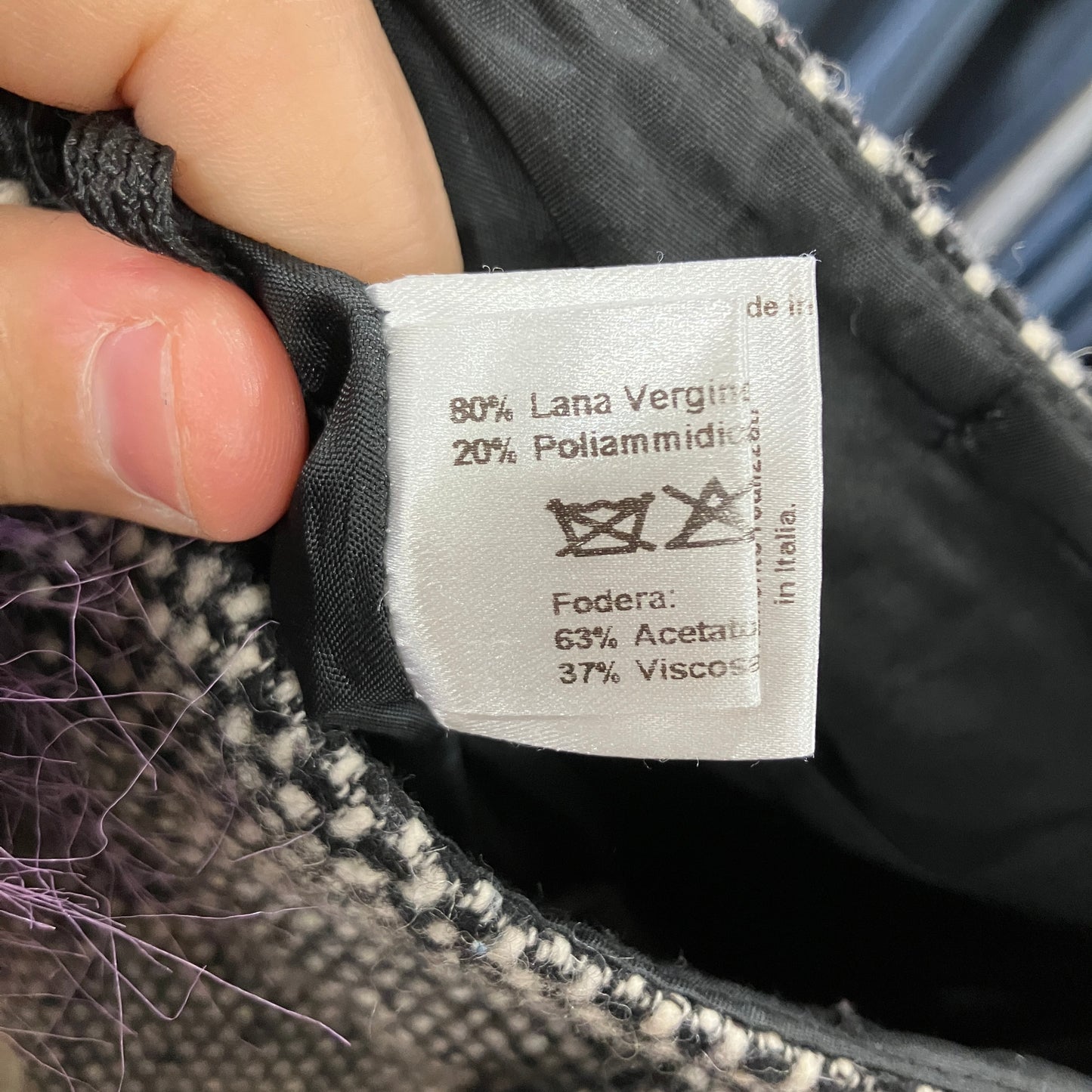 Fabric tag with material information on a textured fabric background