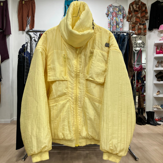 Yellow jacket on a hanger in a clothing store