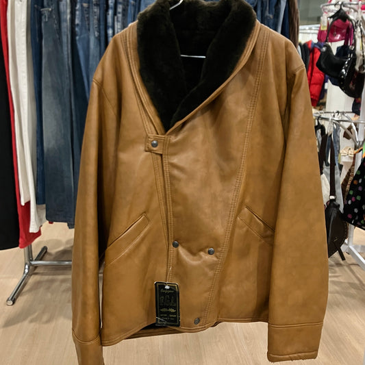 Brown leather jacket with black fur collar on a rack in a store