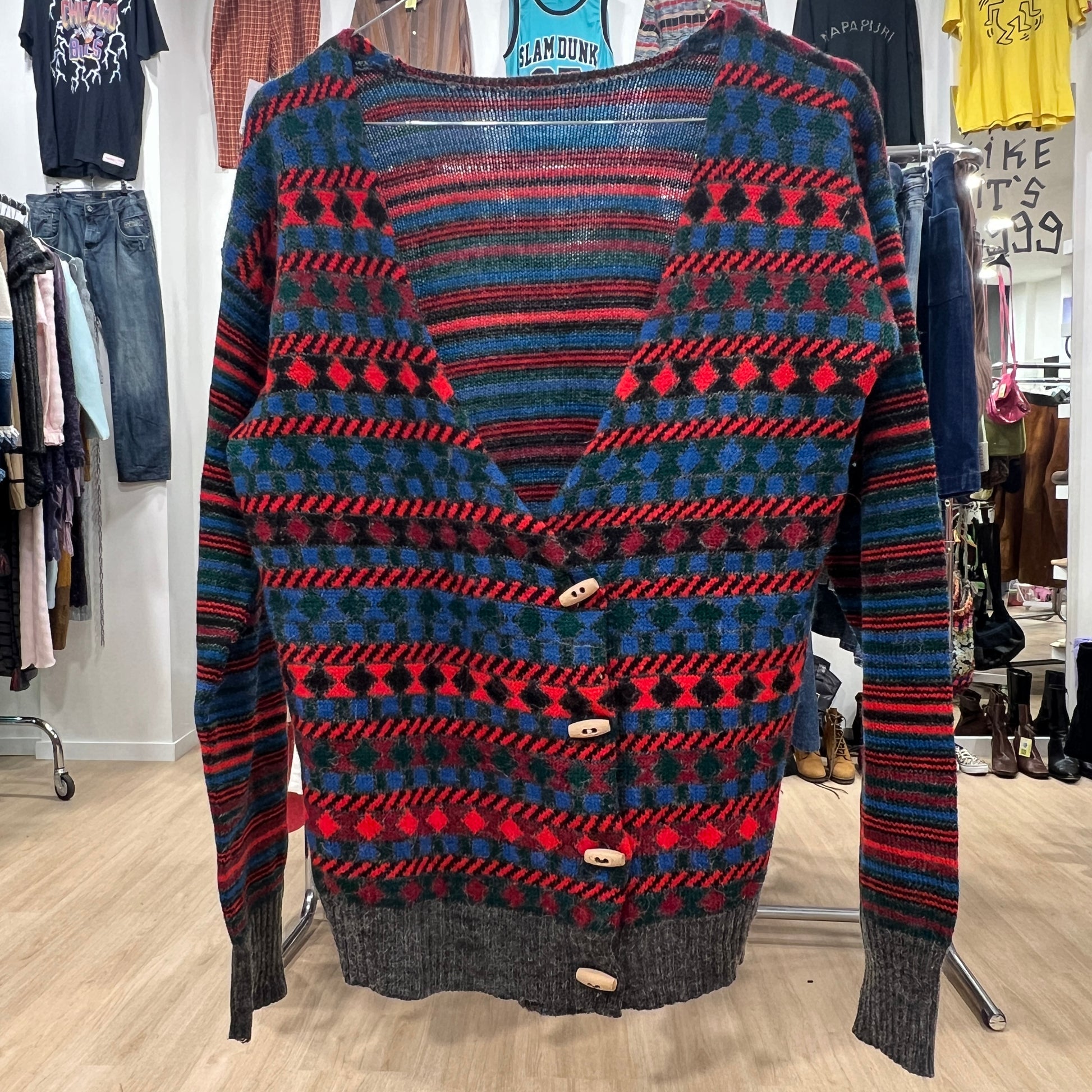Patterned sweater on a rack in a clothing store
