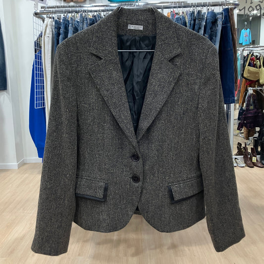Gray blazer on a rack in a store setting