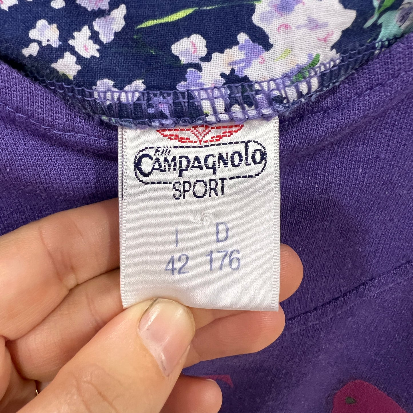 Campagnolo Sport label on a purple garment with floral pattern