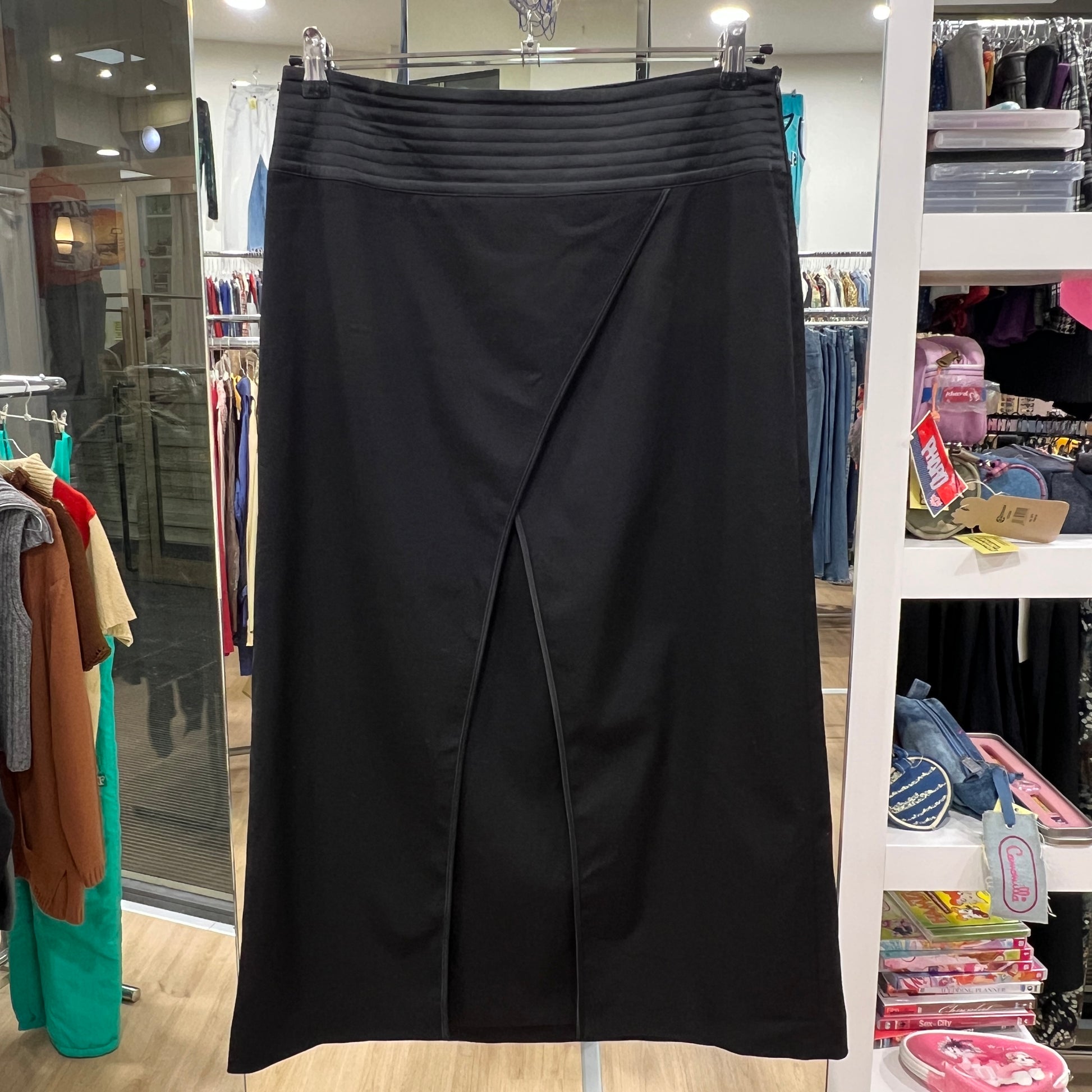 Black skirt on a rack in a store setting