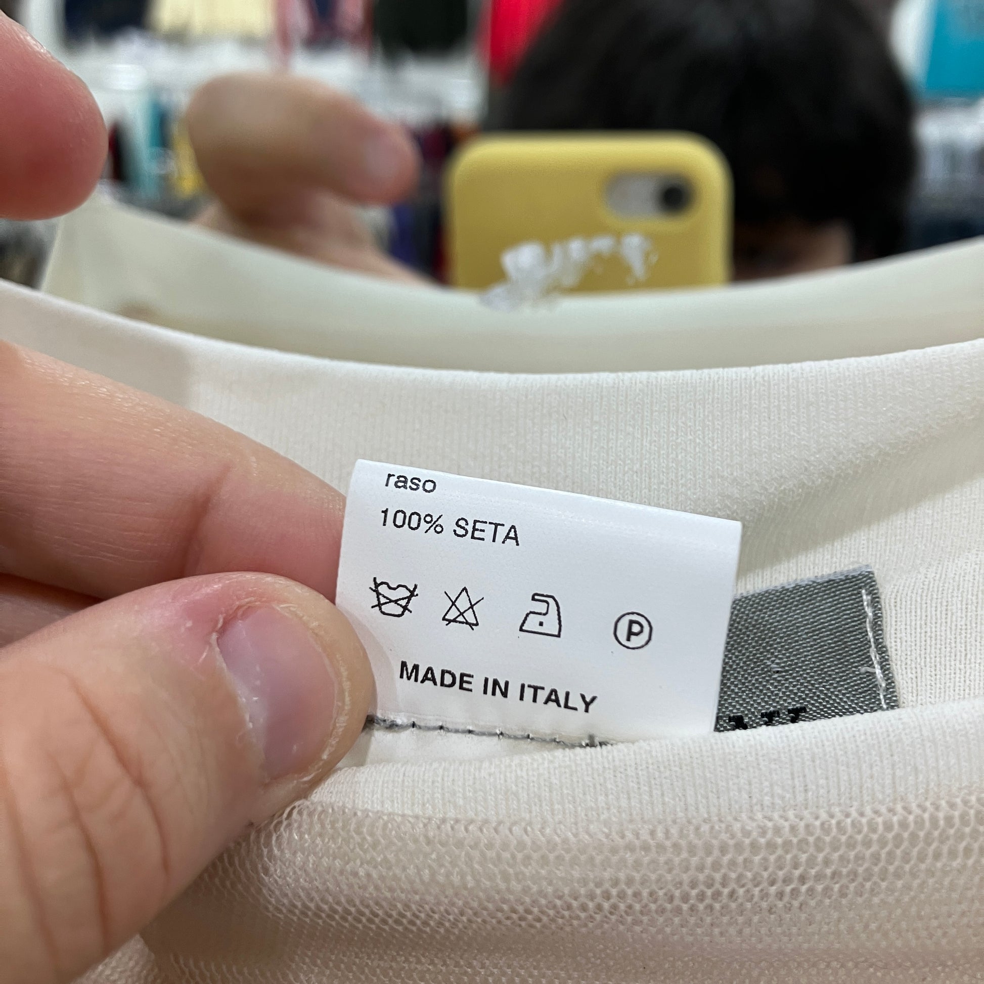 Clothing label on fabric with 'Made in Italy' text