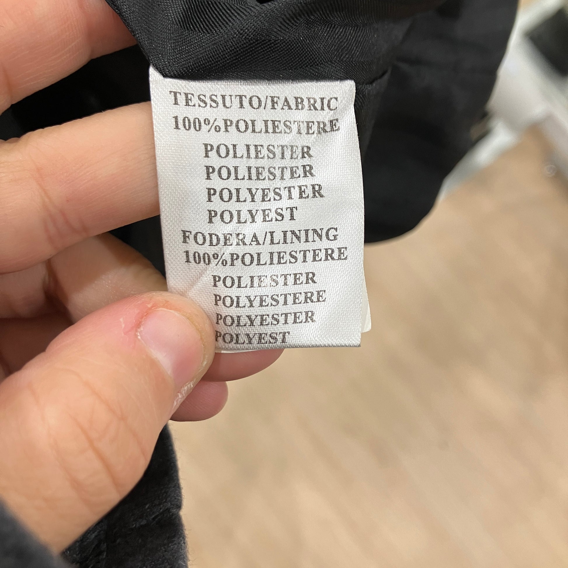 Clothing label with text on a blurred background