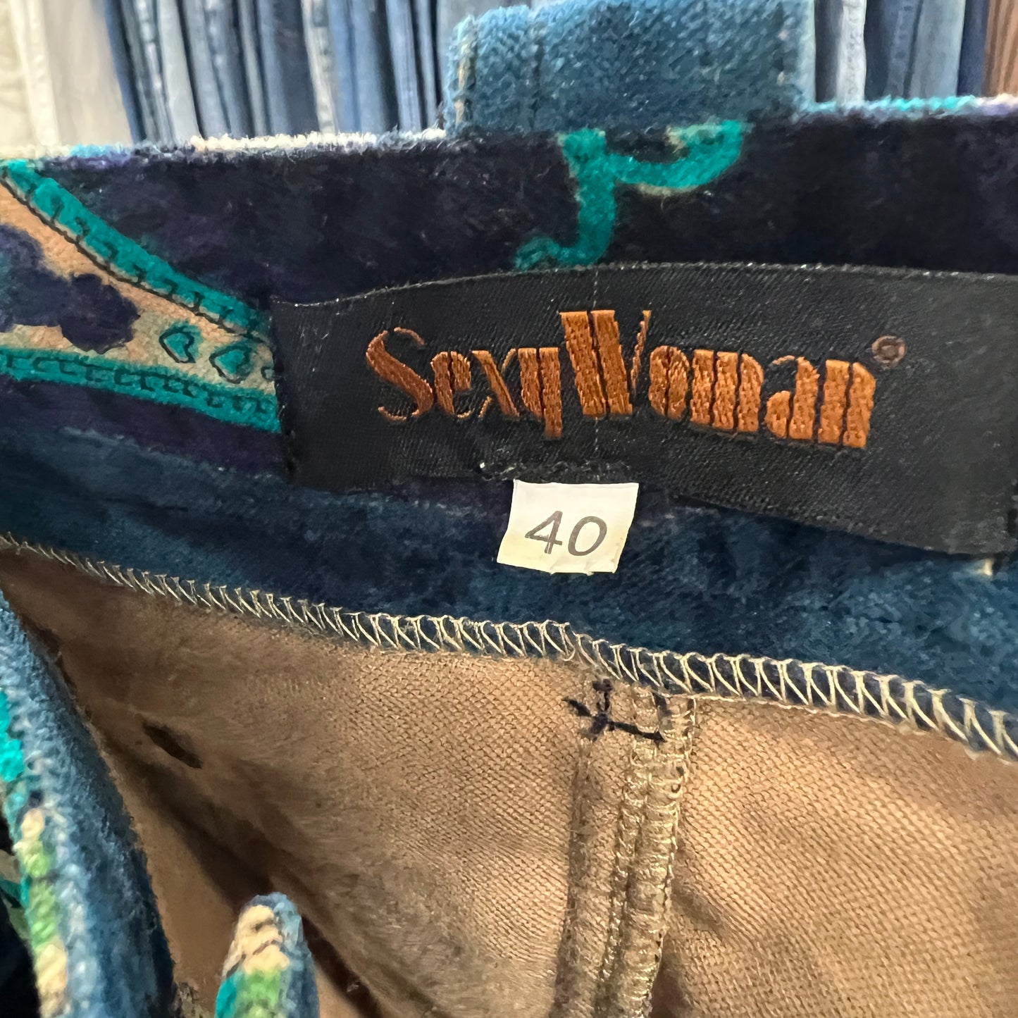 Close-up of a 'Sexy Woman' label on fabric with size 40 tag