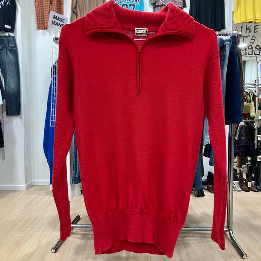 Red sweater on a rack in a clothing store