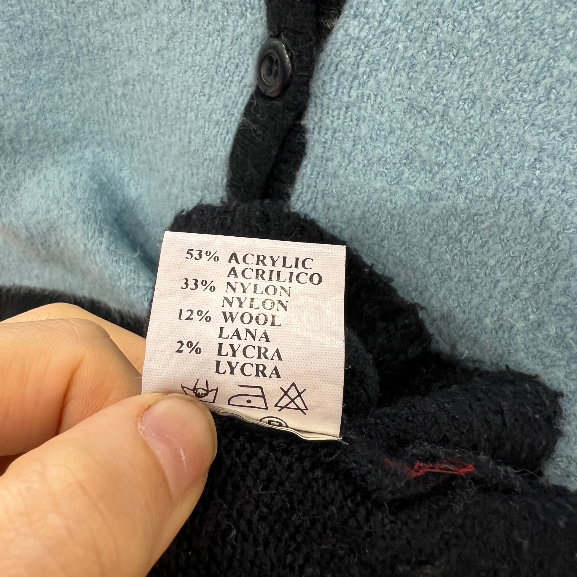 Clothing label with fabric composition details on a garment