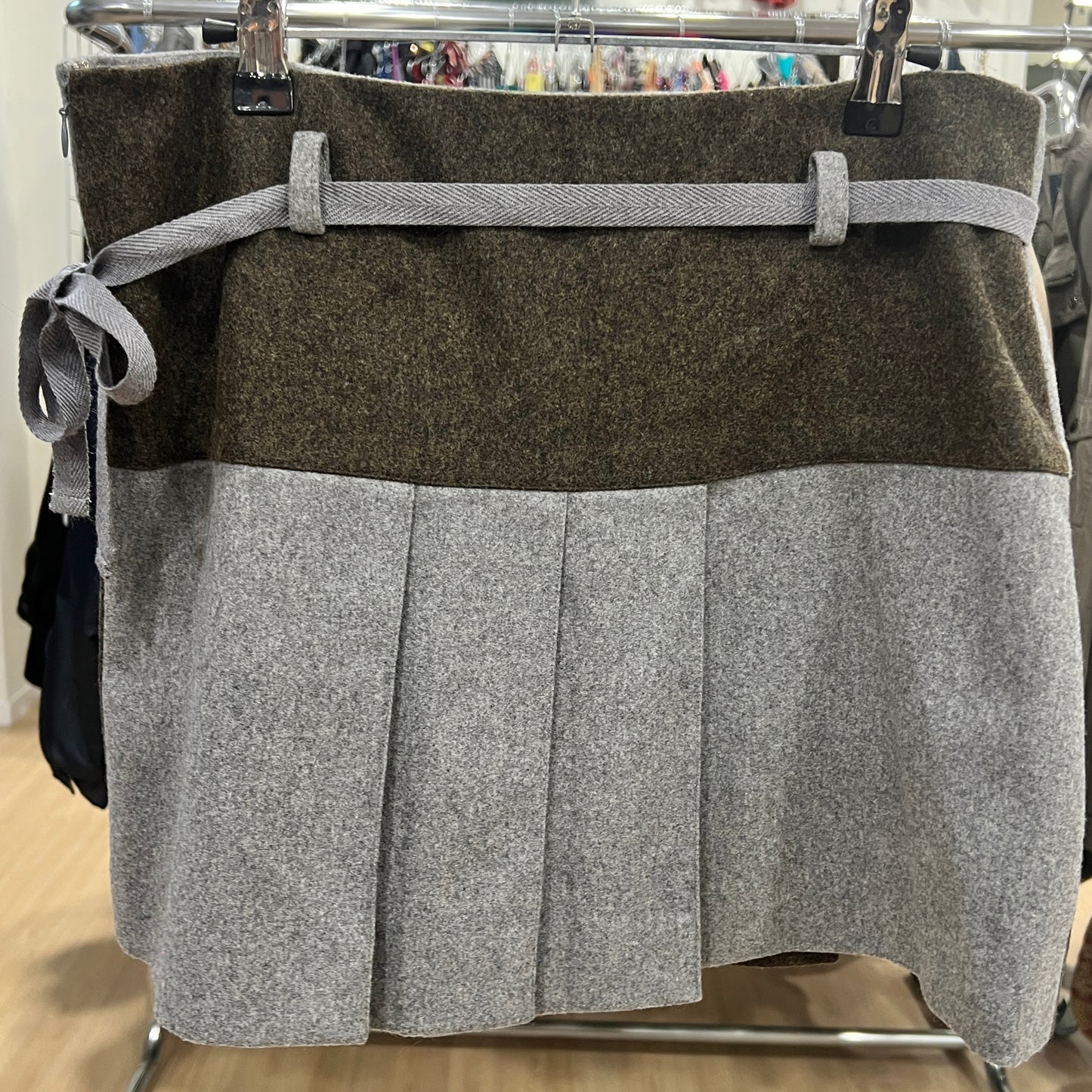 Two-tone skirt with brown top and gray bottom on a hanger