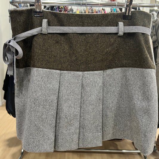 Two-tone skirt with brown top and gray bottom on a hanger