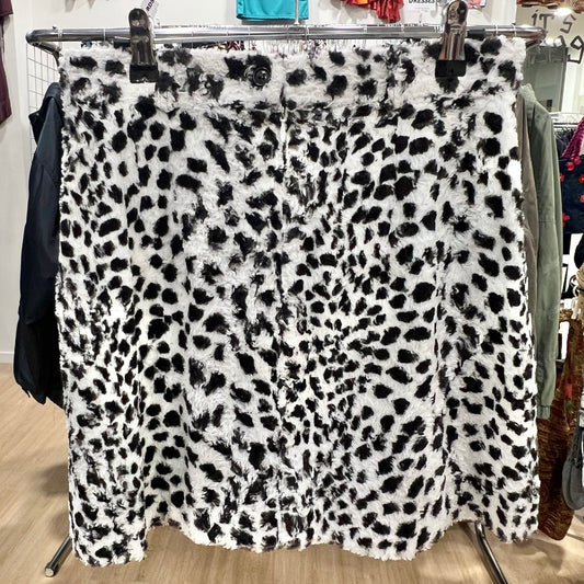Leopard print fabric on a clothing rack in a store setting