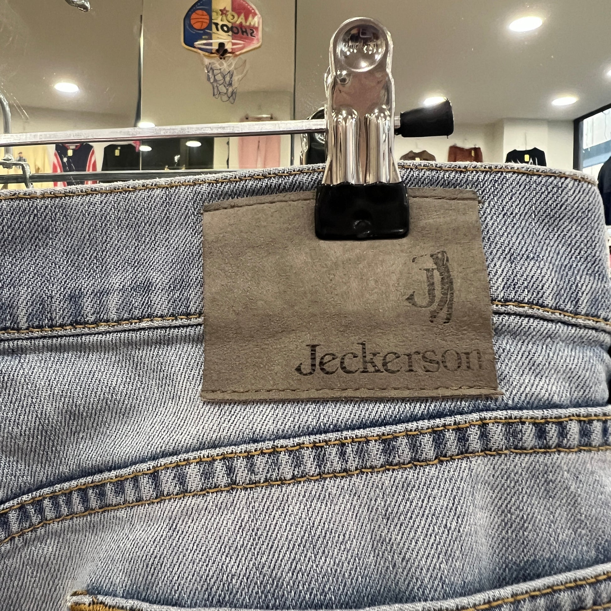 Jeckerson jeans label on a denim fabric background