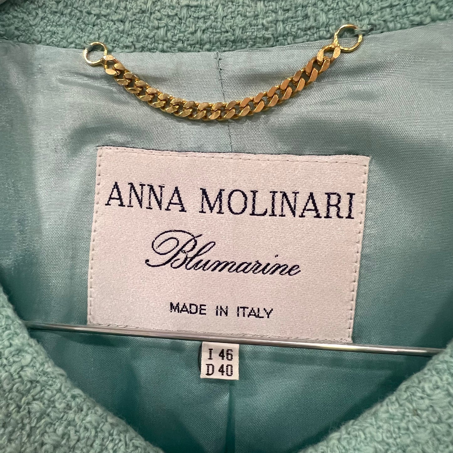 Label on a garment with 'Anna Molinari Blumarine' branding and 'Made in Italy' text