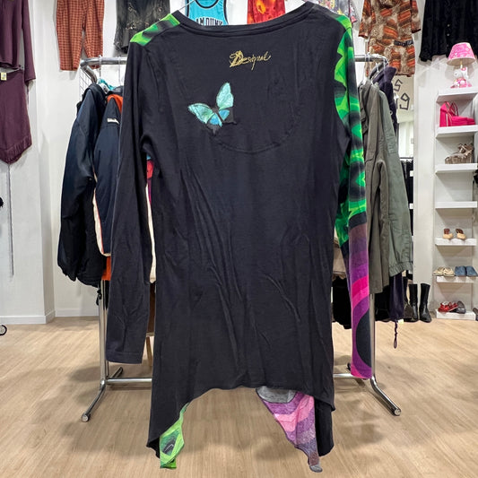Black dress with a butterfly design on a clothing rack in a store