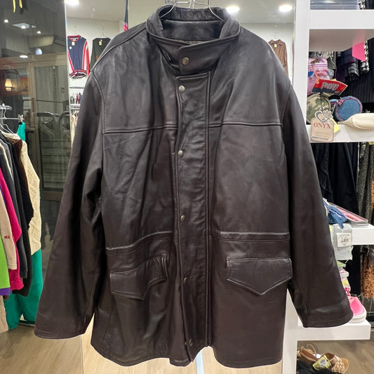 Brown leather jacket on a mannequin in a store setting