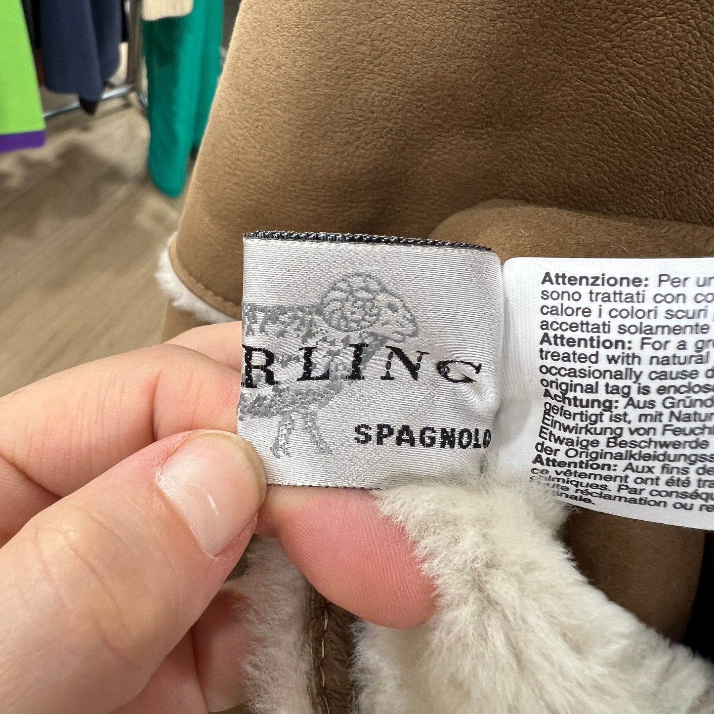 Close-up of a label on a fur product with 'Spagnolo' branding