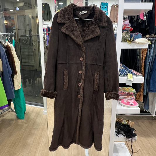 Brown coat with fur collar on a rack in a store setting