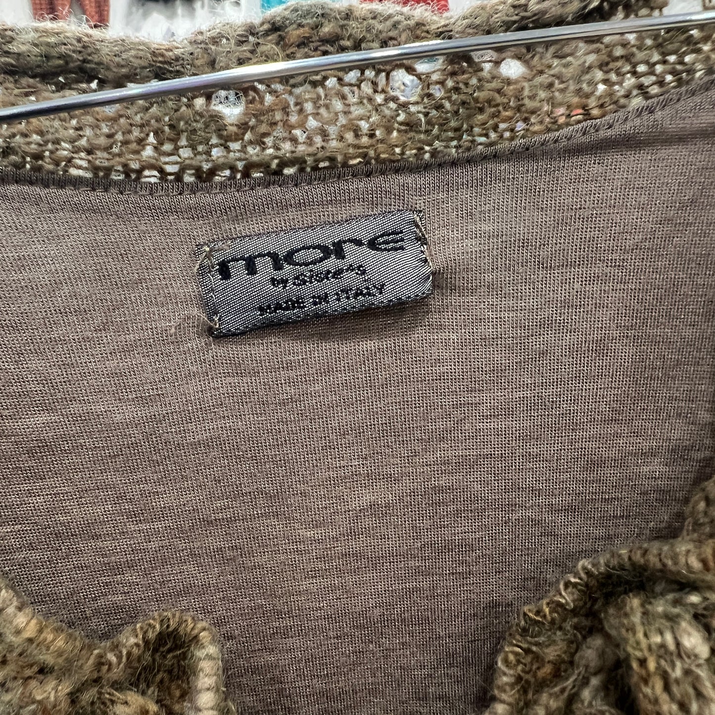 Textile product with 'more' label on a textured fabric background