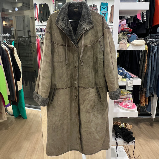 Brown suede coat with fur collar in a clothing store
