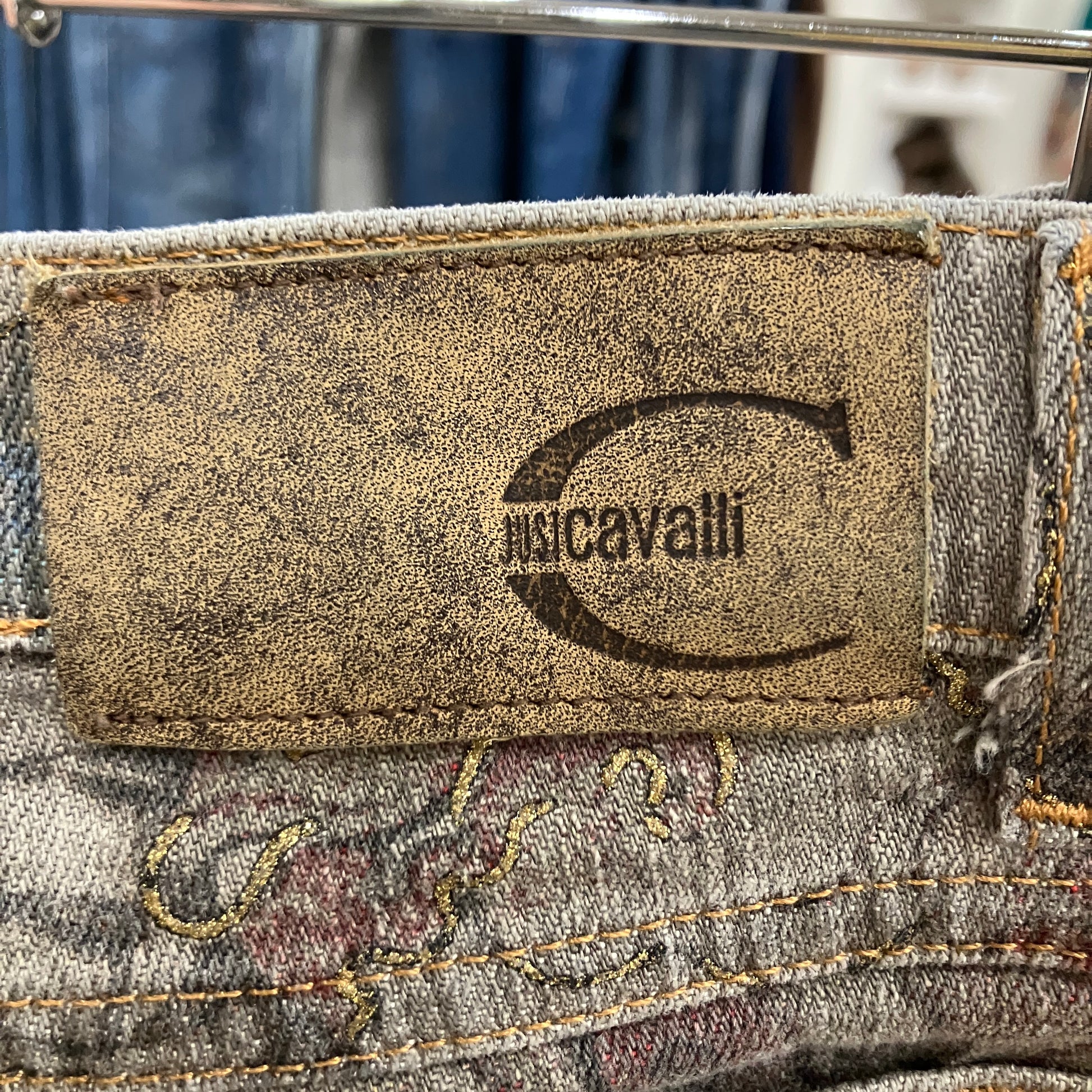 Close-up of a justCavalli label on a piece of denim fabric
