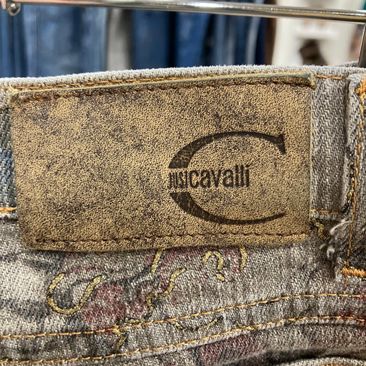 Close-up of a justCavalli label on a piece of denim fabric