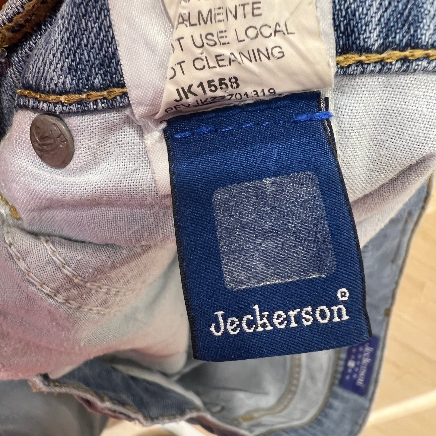 Jeckerson label on a denim product with a visible tag