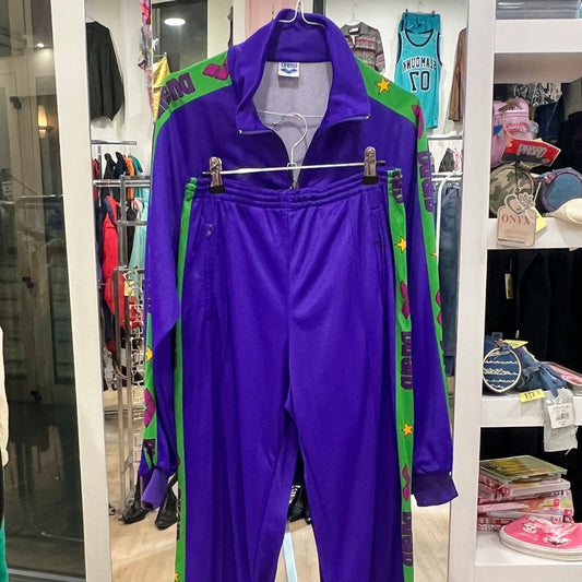 Purple tracksuit on a hanger against a store background with various items