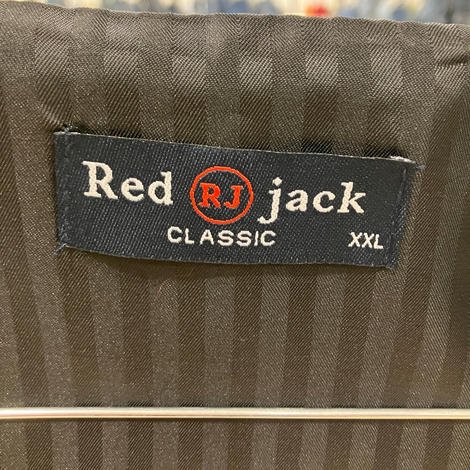 Label on a brown fabric with 'Red Jack' branding