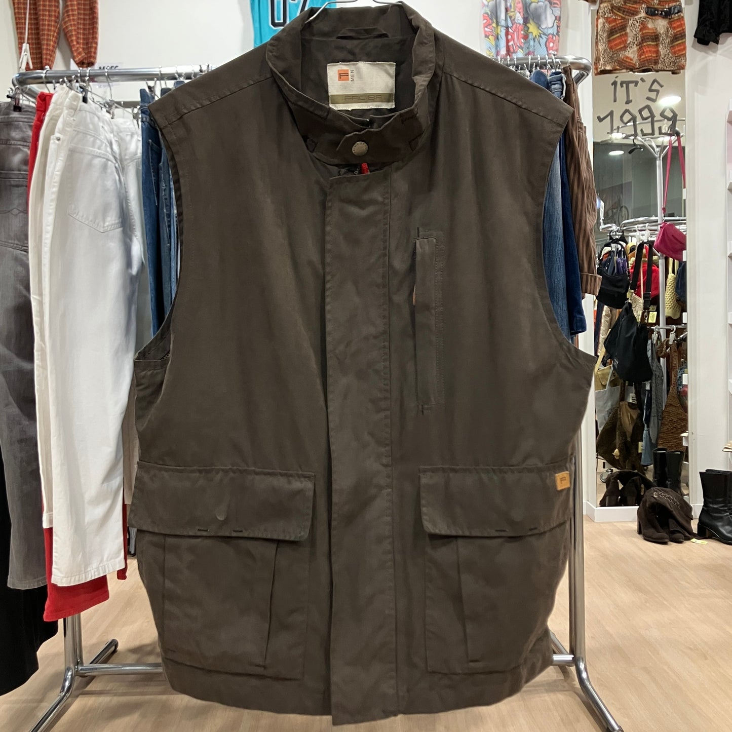 Brown vest on a rack in a clothing store