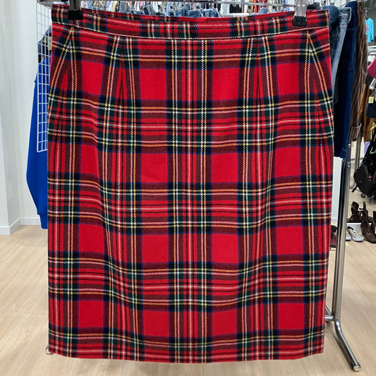 Red plaid skirt on a rack in a store setting