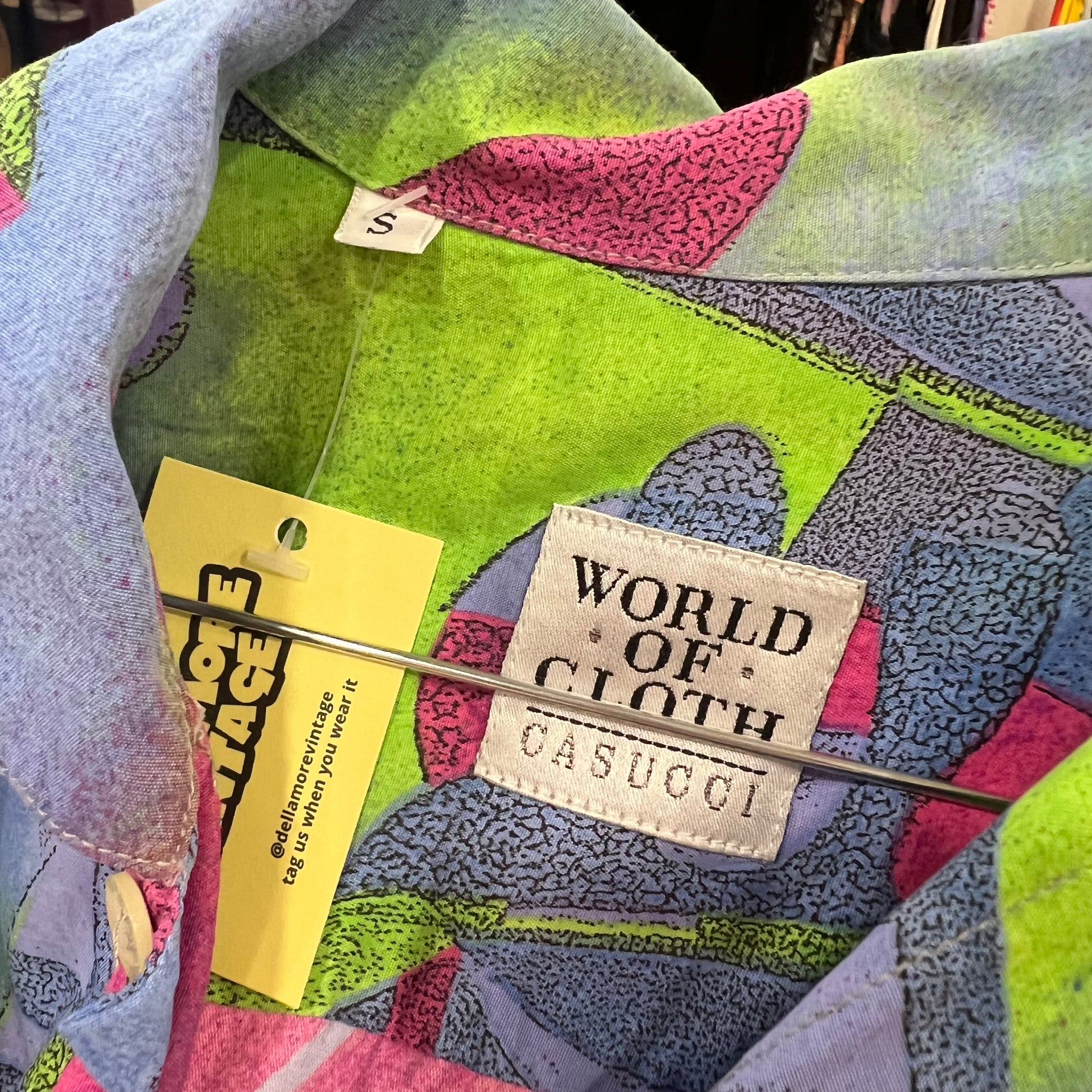 Colorful shirt with 'World of Cloth Casucci' label and tag