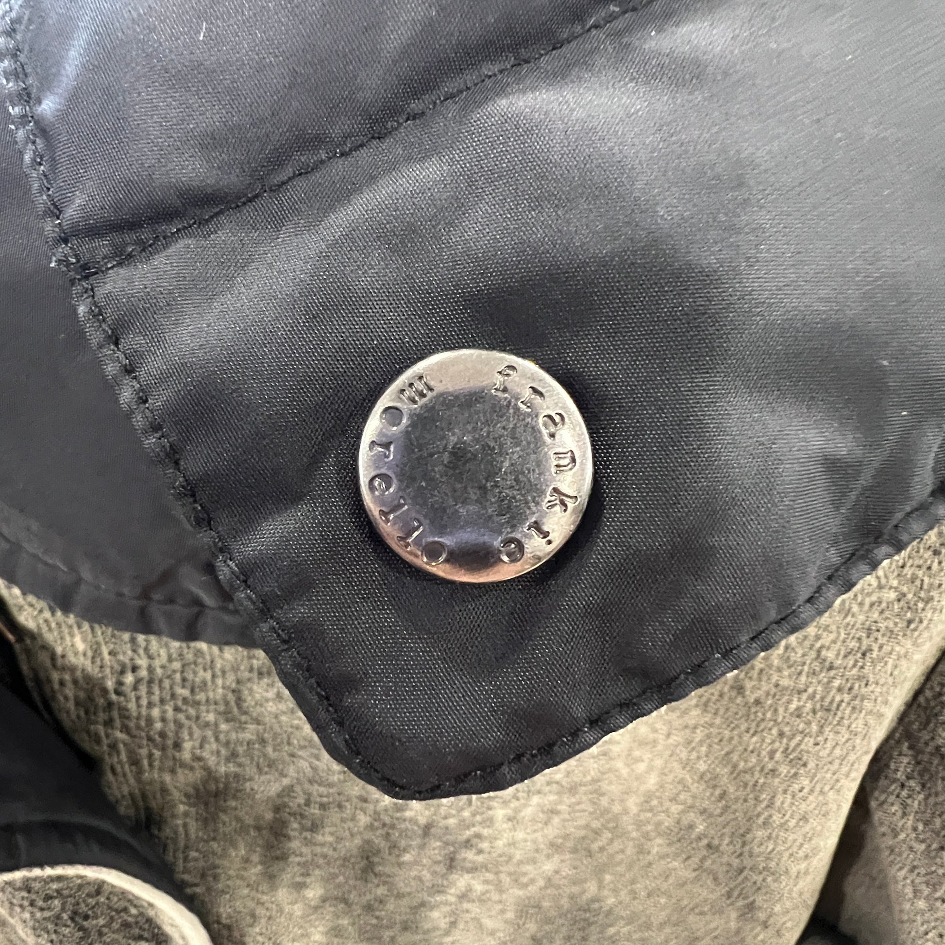 Close-up of a button on a jacket