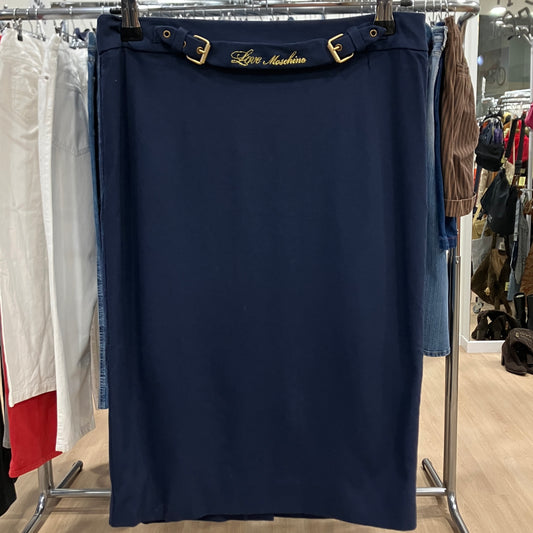 Navy blue skirt with gold buckle on a rack in a store setting
