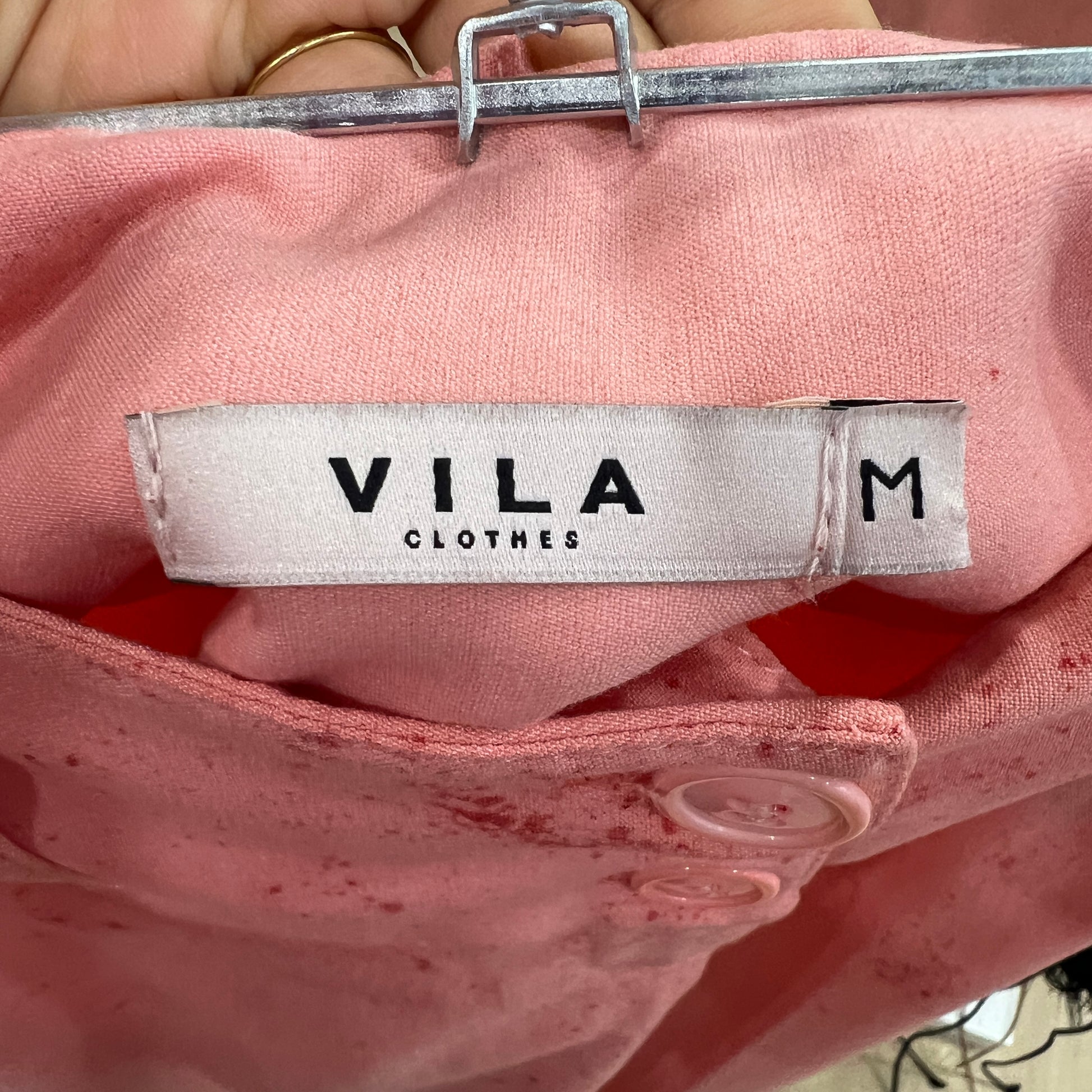 Pink garment with Vila label showing size M