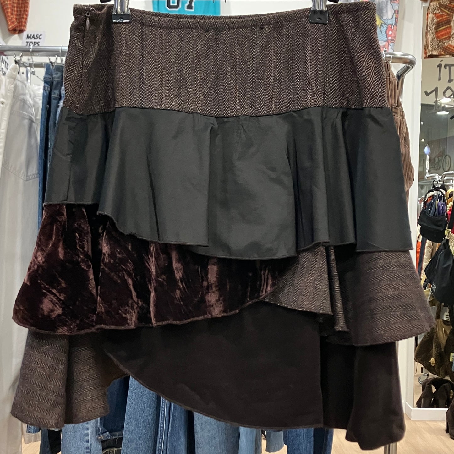 Multicolored layered skirt on a hanger in a store setting