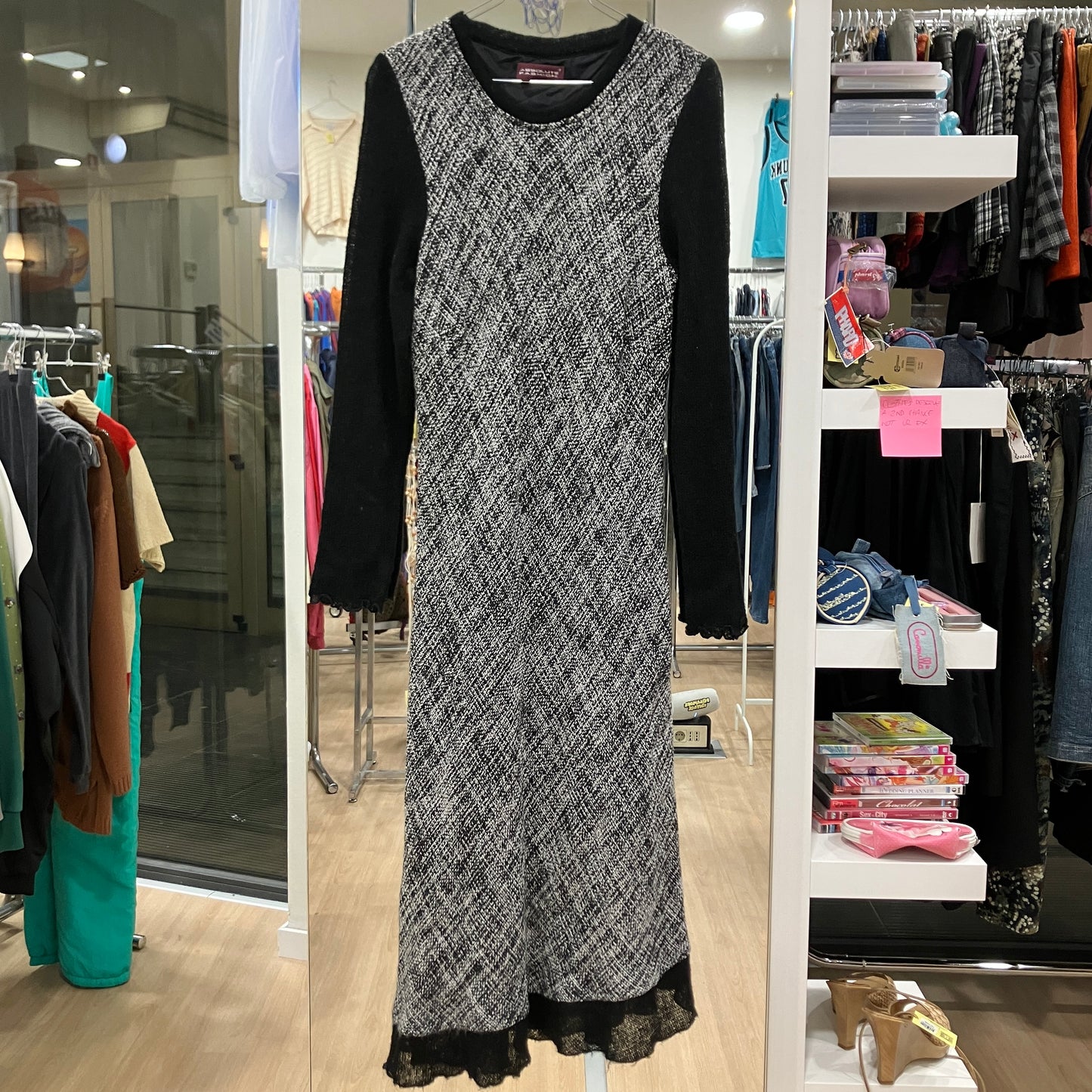 Black and white patterned dress on a rack in a store setting