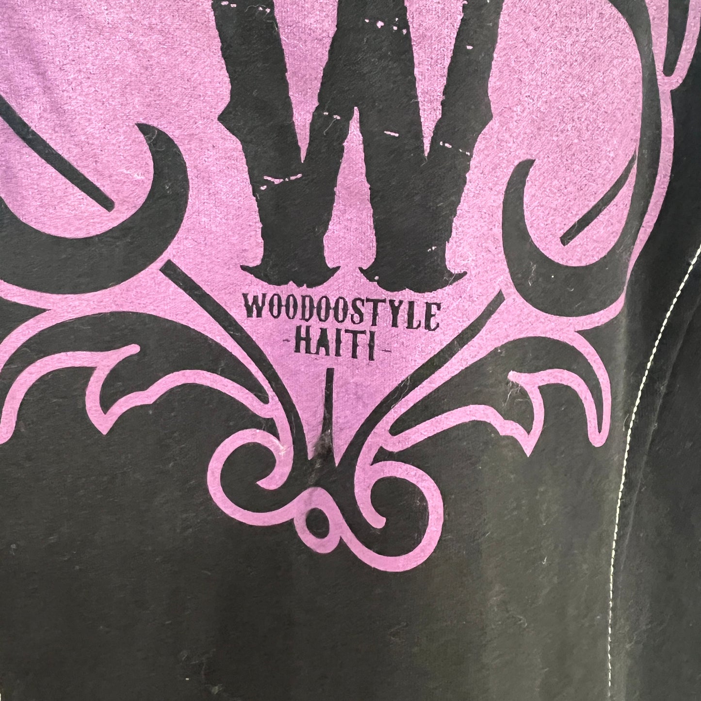 Black and pink design with 'Woodostyle Haiti' text on a textured background