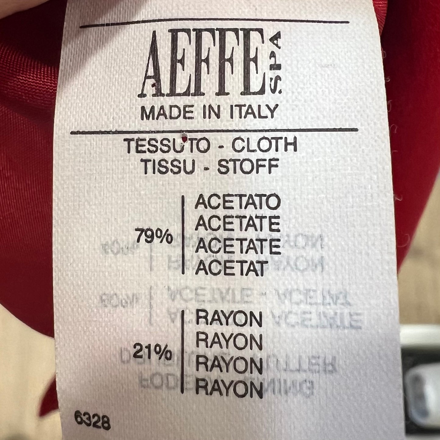 Clothing label with 'AEFFE SPA' branding and fabric composition details