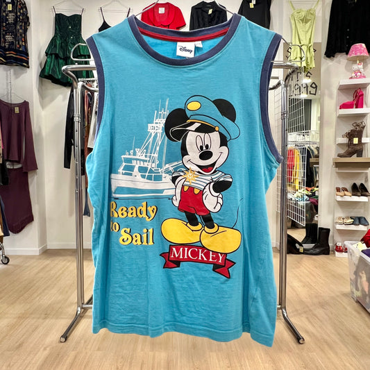 Blue tank top with Mickey Mouse design in a store setting