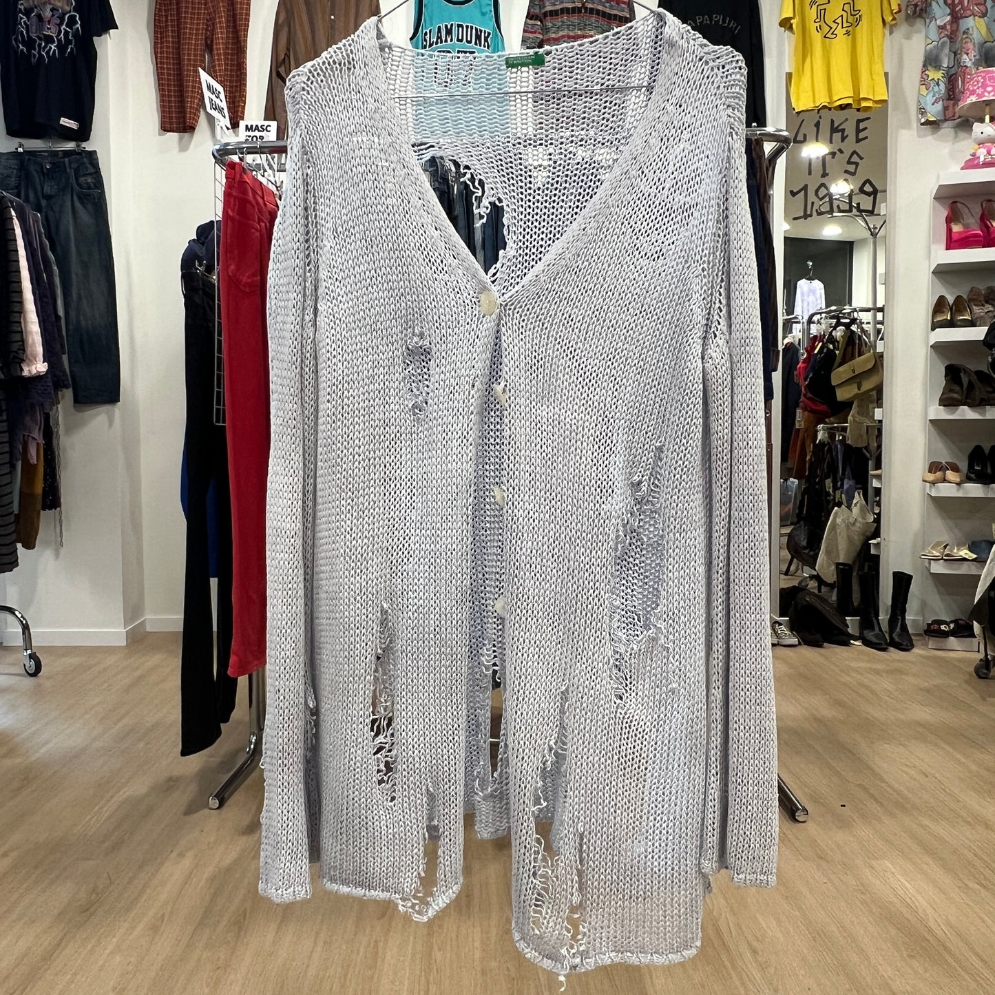 Silver sequin dress on a hanger in a clothing store