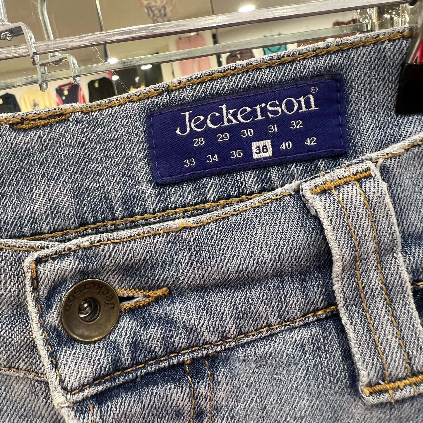 Jeckerson jeans label on a denim fabric background