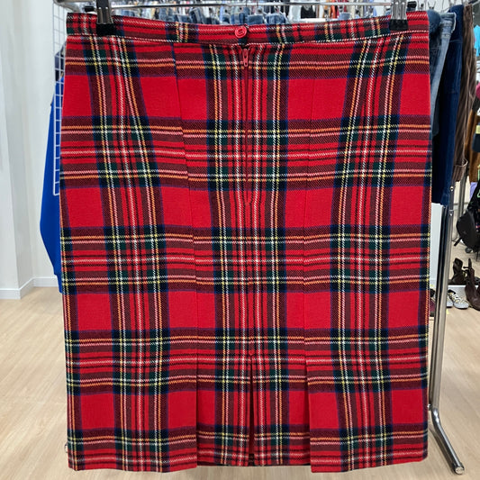 Red plaid skirt on a rack in a store setting