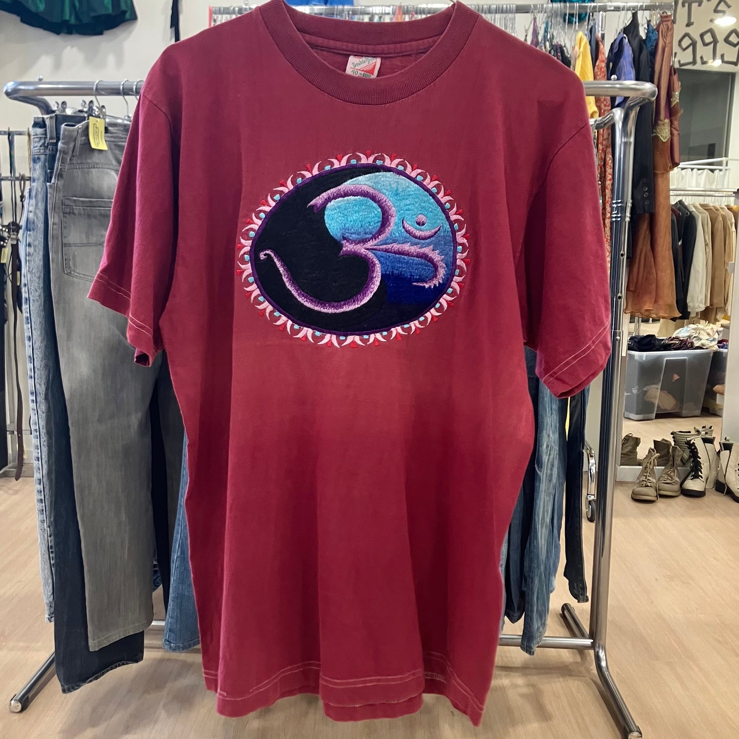 double apple burgundy tee with blue om meditation graphic