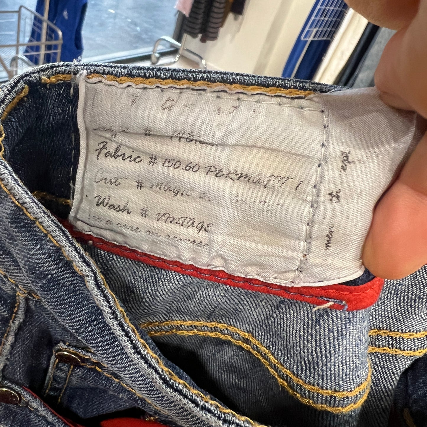 Close-up of a denim pocket with a label 