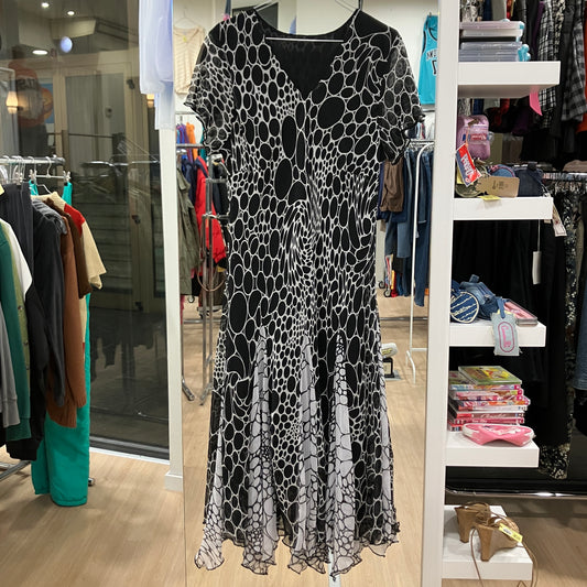 Black and white patterned dress on a mannequin in a store setting