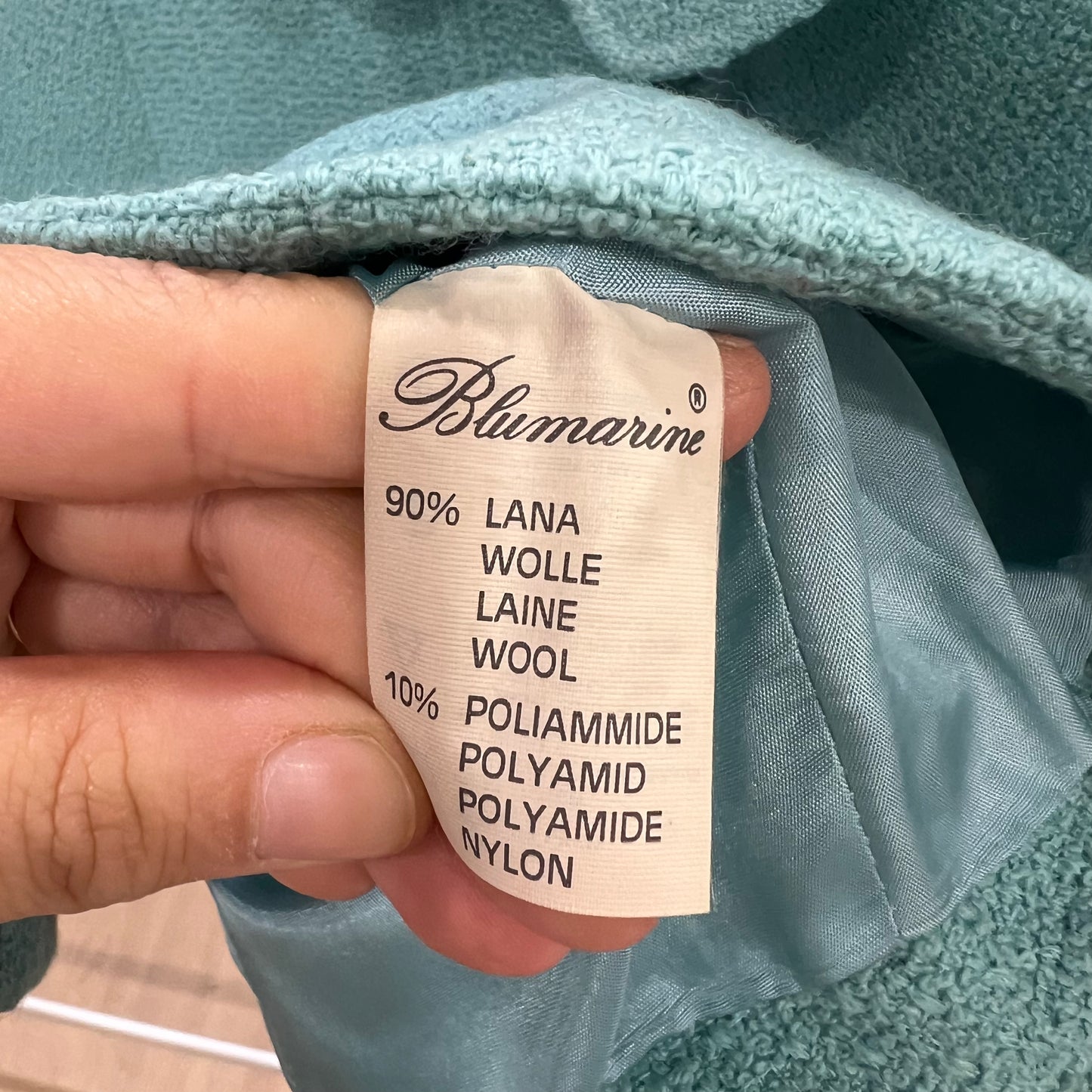 Clothing label with 'Blumarine' brand name and fabric composition details