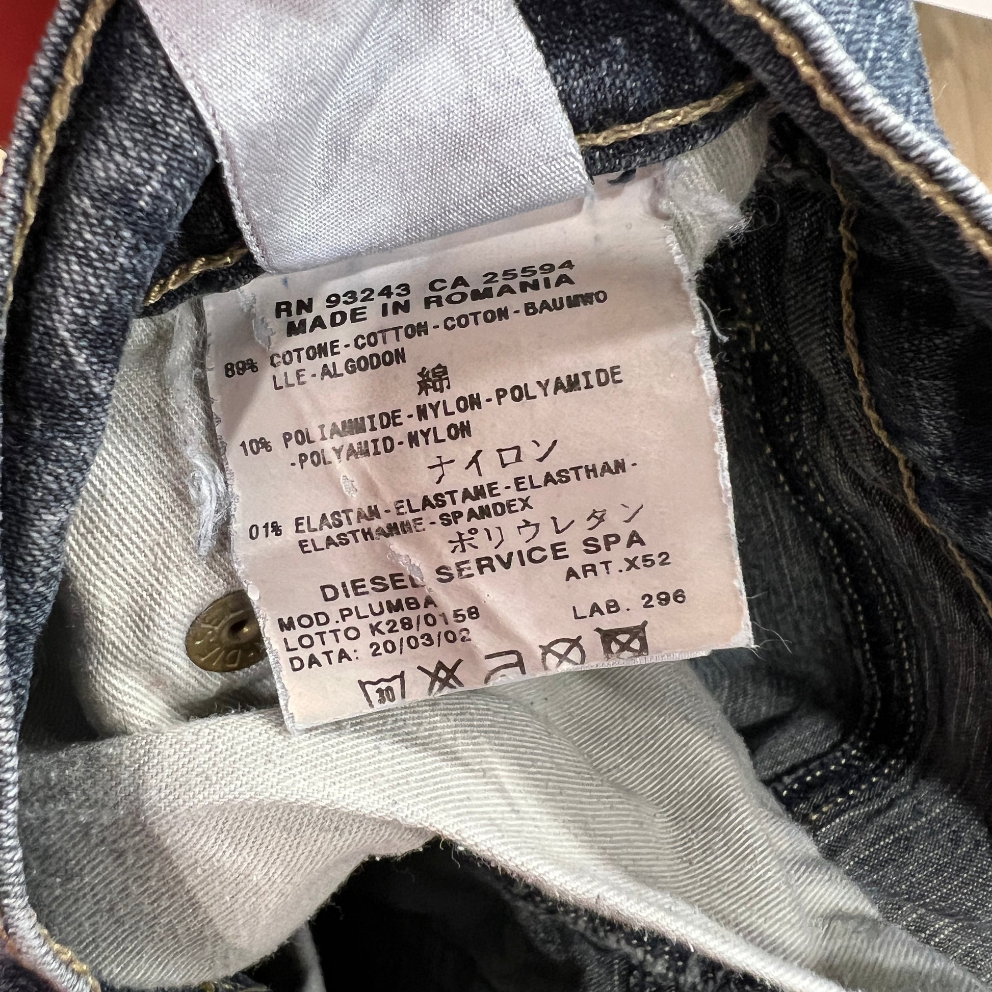 Denim label with text and symbols on a denim background