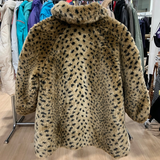 Leopard print coat on a hanger in a clothing store