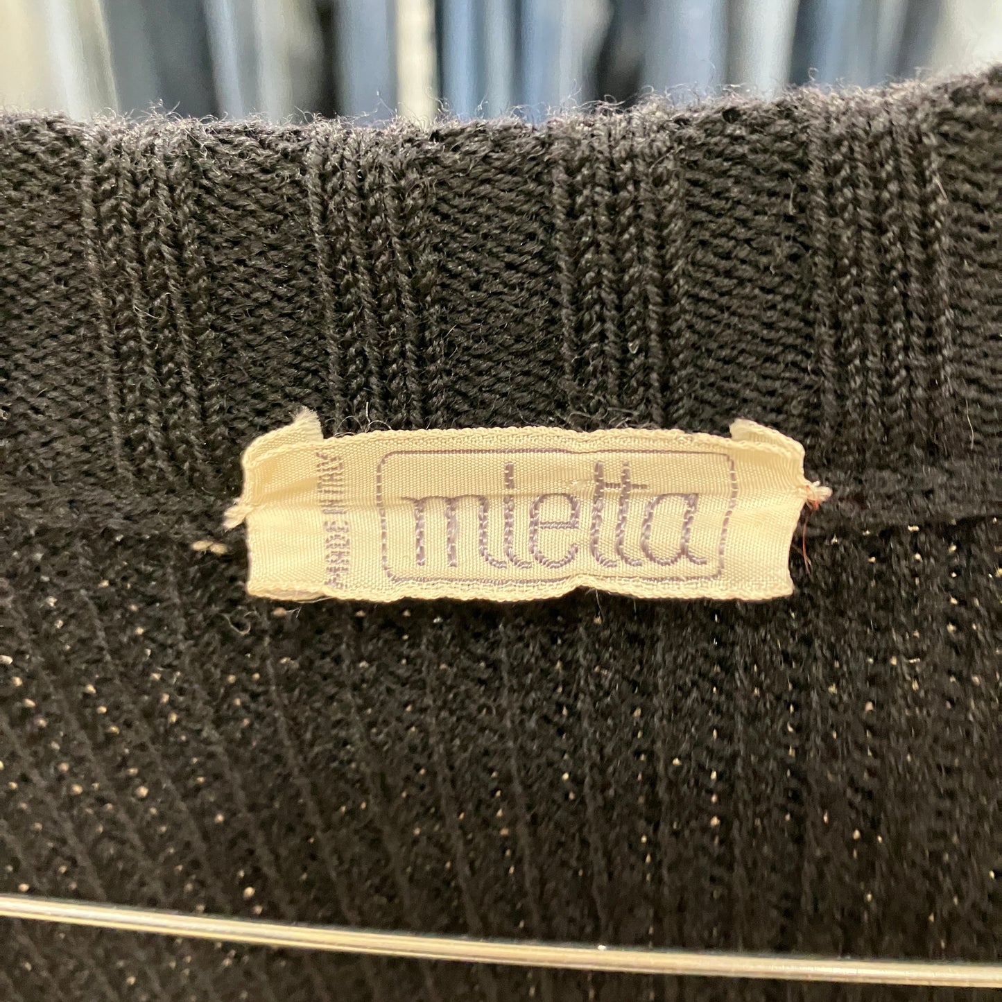 Textile product with 'miletta' label on a textured background